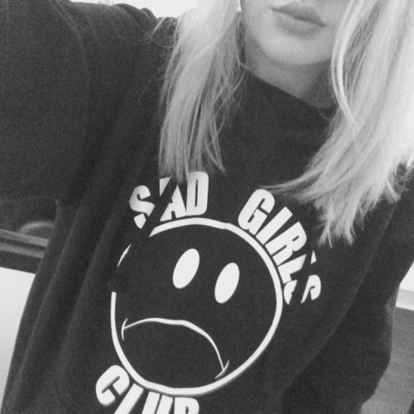 sad girl in hoodie