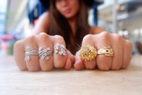 Girl wearing multiple jewelry ring