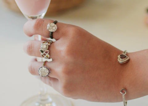 Hand with Fashion Jewelry Holding a drink