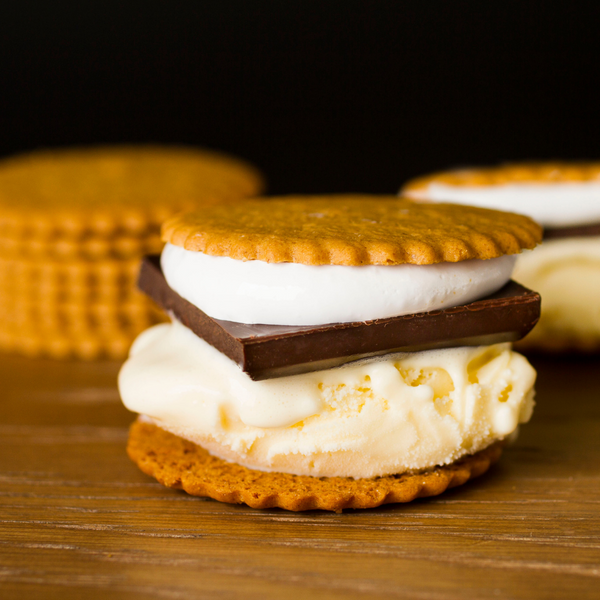 Pumpkin Moravian Cookie Thins S'mores sandwich with ice cream, marshmallow, and a square of chocolate