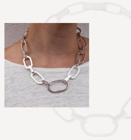 An image of the Annie Necklace on a model showing this more petite version of our chunkiest style of handmade chain jewelry.