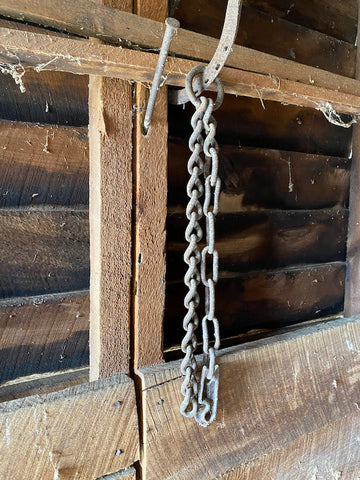 A photo of a scrap of chain found in Hanging Barn Studio during renovation.