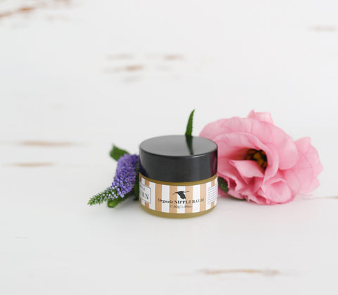 Organic Natural Nipple Balm in small tub with pink and purple flowers