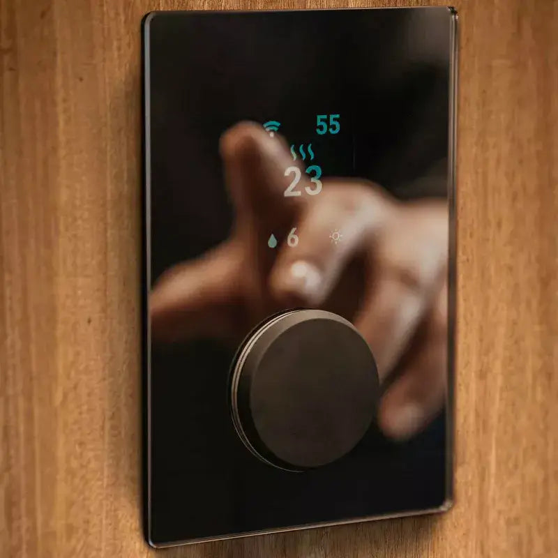 A sleek, digital wall-mounted sauna controller