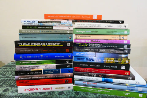 Stack of Staples Fund books by Charlie Staples