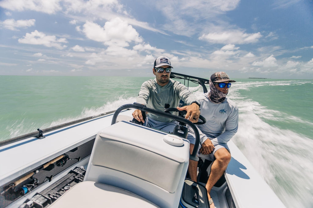 Two men going fast in a fishing boat