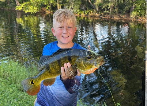 Kid catching a bass