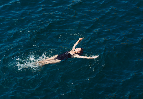 Lady swimming in sea