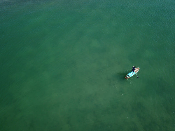 Paddle boarding in the vast ocean. 
