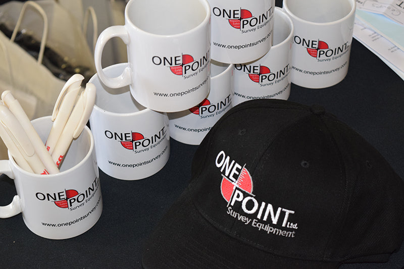 One Point Survey branded hats and mugs