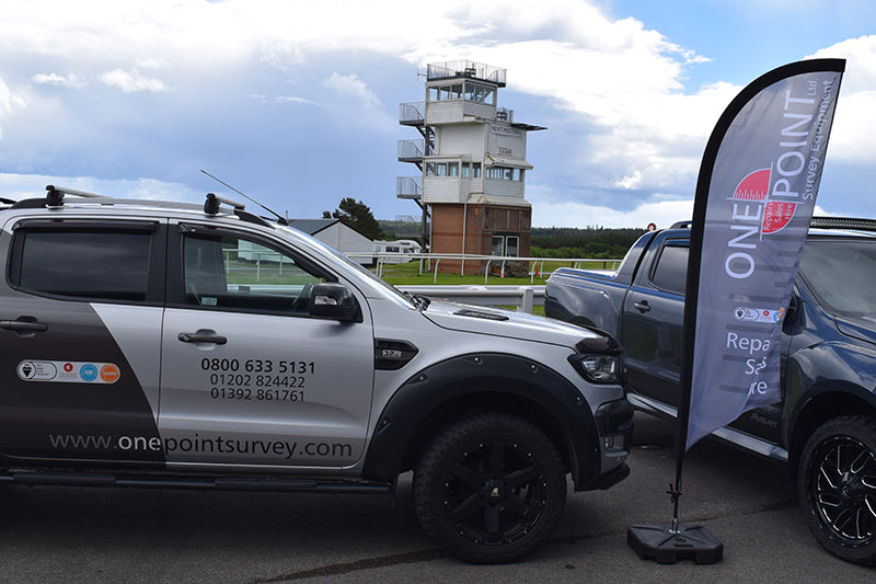 One Point Survey van and banners at event at Exeter Racecourse