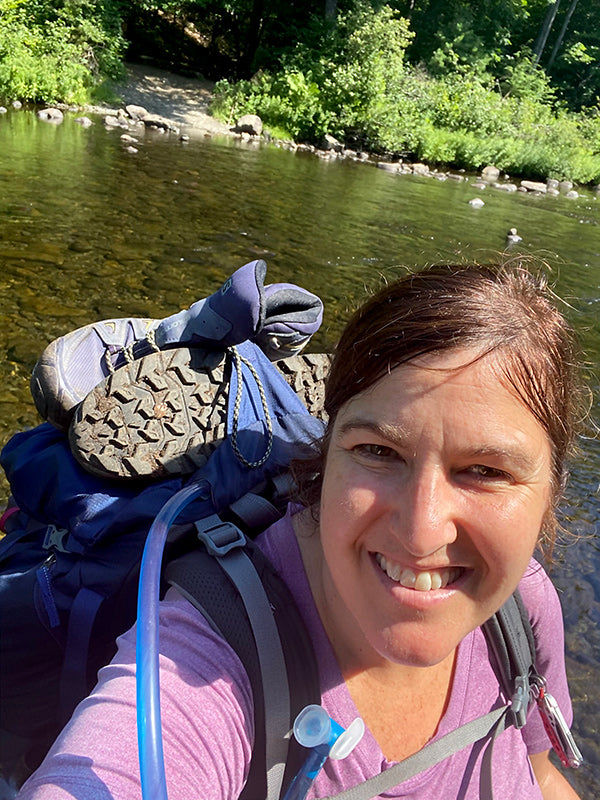 Catherine Grisez river crossing while backpacking the Appalachian Trail