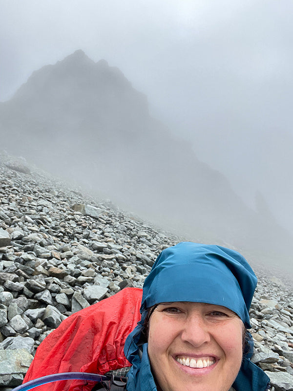 Catherine Grisez hiking in a cloud up a mountain on the PCT in Washington