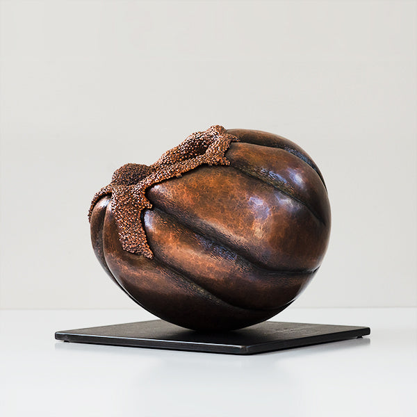 hammered copper sculpture with grooves and bumpy detail, handcrafted in Seattle by artist Catherine Grisez