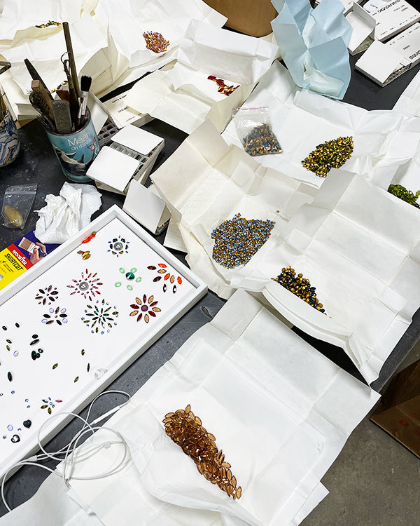 vintage Swarovski crystals laid out for ghost collaboration