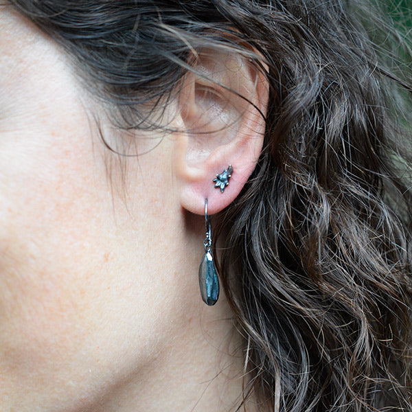 darkened silver rock drop earrings paired with little succulent stud in second piercing, handcrafted nature inspired jewelry made in Washington State