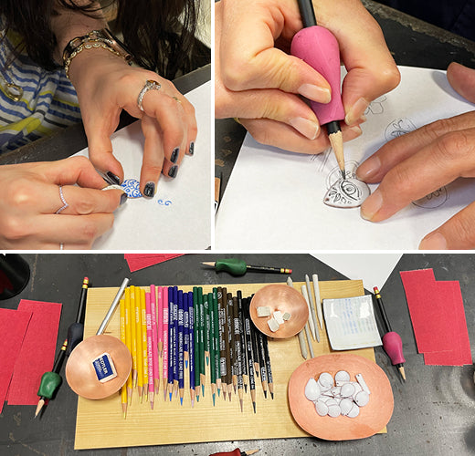 drawing on enameled copper pendants with enamel pencils and other tools at CG class