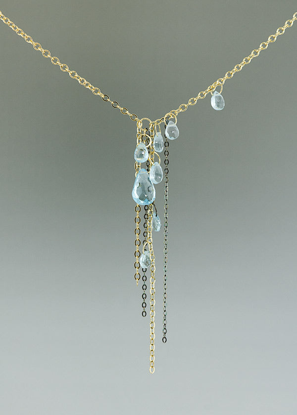 blue topaz, 14k gold, and black silver necklace handcrafted by seattle artist Catherine Grisez