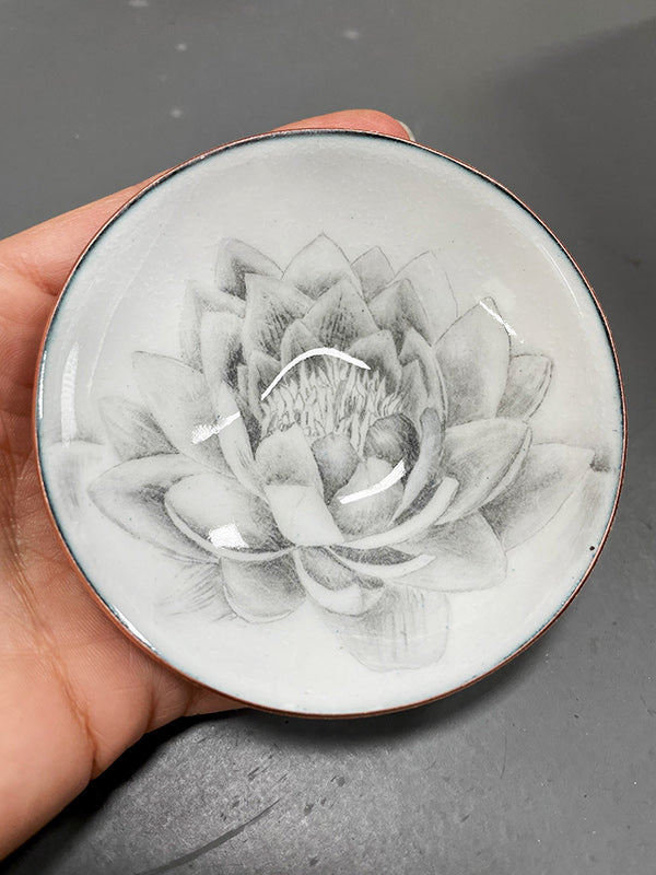 hand drawn lotus flower embedded in glass and copper bowl, a gift to represent new beginnings handcrafted by artist Catherine Grisez