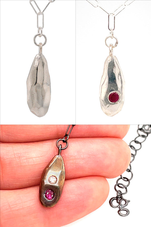 his image has two profiles of the same necklace. The back of the necklace is completely hammered sterling silver. And the front of the necklace has a Ruby encrusted in the necklace. 