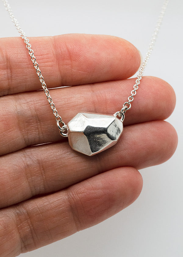 sterling silver rock necklace hand carved in wax and then cast in silver made by Seattle artist Catherine Grisez for CG Sculpture and Jewelry