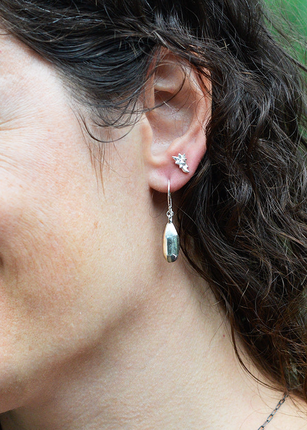 solid sterling silver handmade art jewelry inspired by nature. Rock droplets paired with tiny succulent plant post earrings