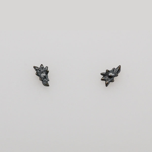 darkened silver succulent stud earring, tiny flower hand carved by artist Catherine Grisez