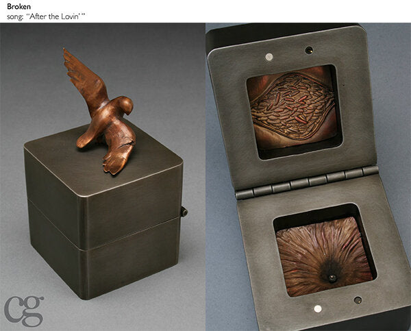 Broken steel and bronze bird music box sculpture with lava and bird with broken wing
