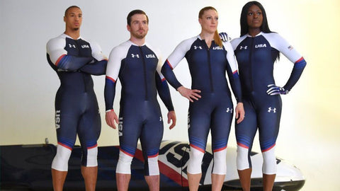 Hakeem Abdul-Saboor and teammates standing in Team USA 2022 Olympics bobsledding uniform