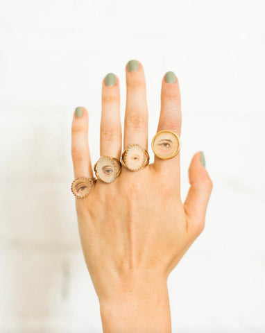 hand with 4 modern custom lover's eye rings