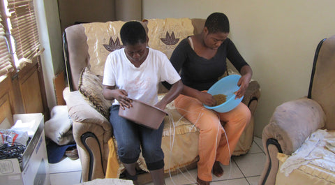 Themba and Phebee stinging beads for Godfrey's animals