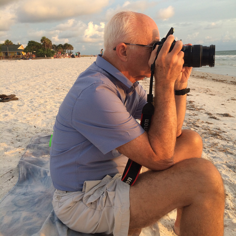 My father taking a photo of the sun