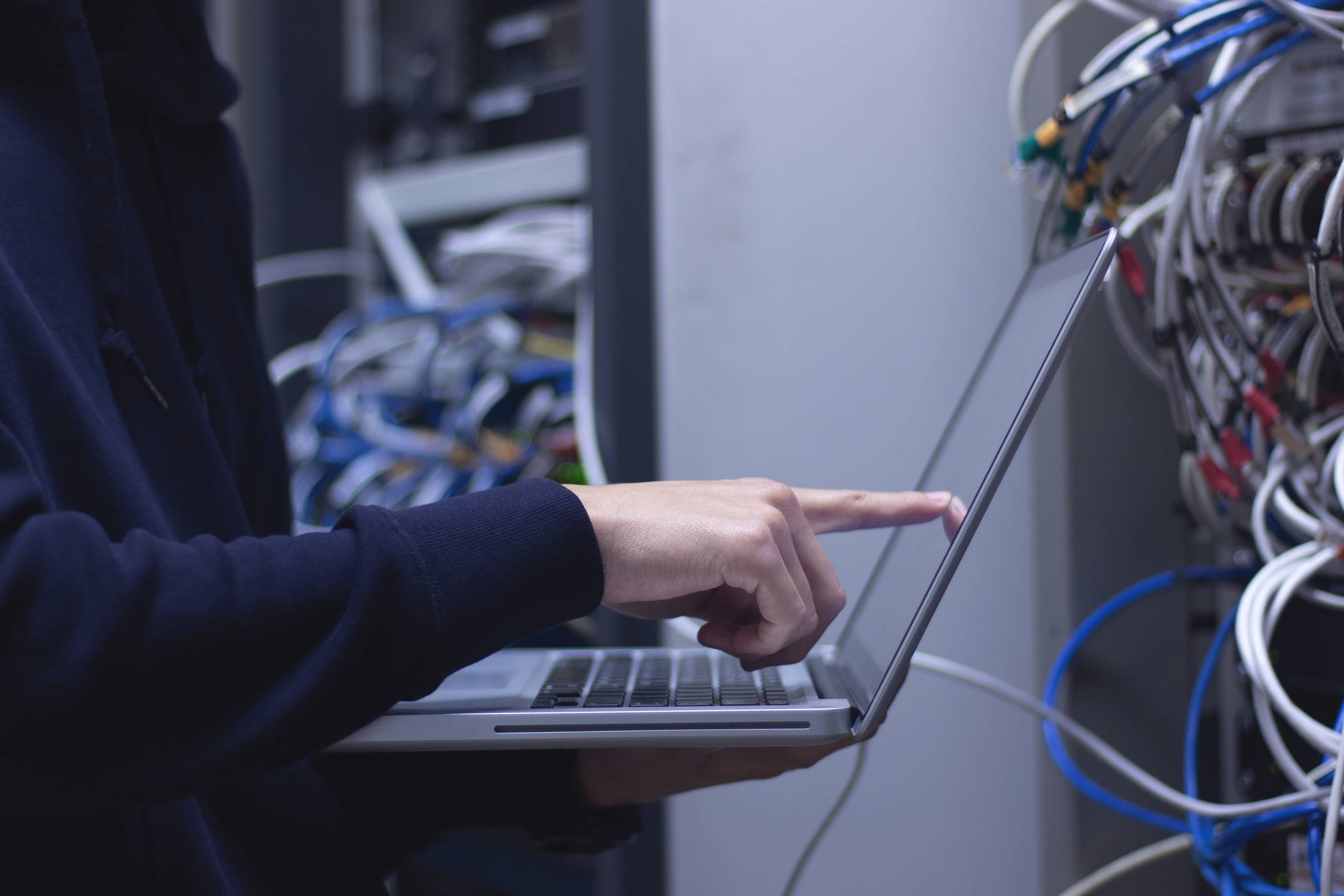 close-up-hands-administrator-technician-working-laptop-data-center.jpg__PID:1bbaf188-b360-4d4d-8503-04a04b02a31b