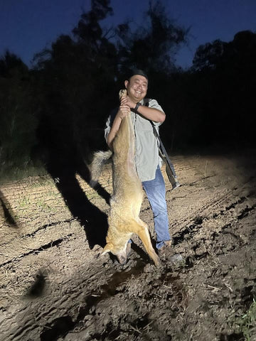 hunter with a coyote