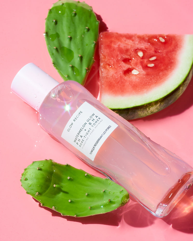 Watermelon glow PHA + BHA pore-tight toner on pink backdrop with fruit