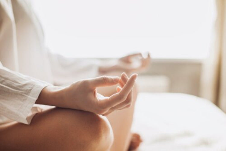 Close-up lotus position hands on knees