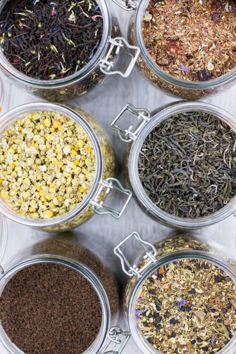 Top view Six sorts of tea in mason jars