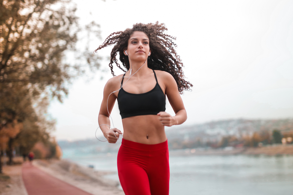 young woman running outdoors after good night's sleep