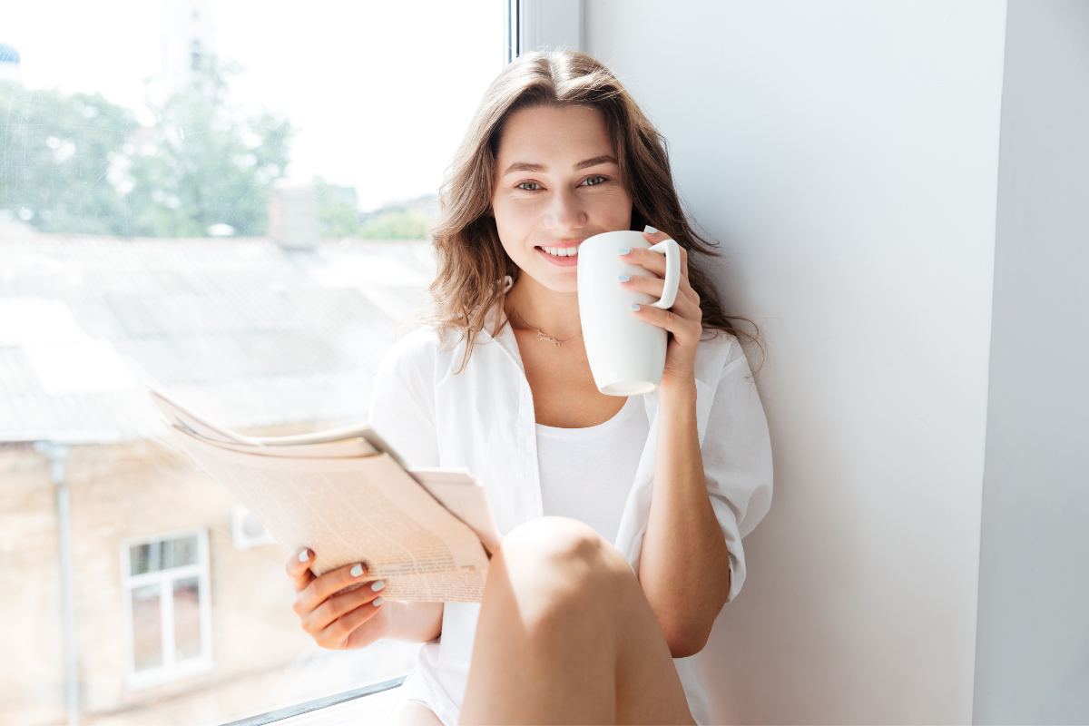 Young woman drinking coffee in morning after a good night's sleep