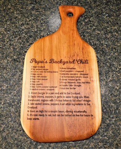 Papa's Backyard Chili Recipe on a handcrafted cutting board handcrafted and engraved by Springhill Millworks using locally sourced hardwood in Michigan.