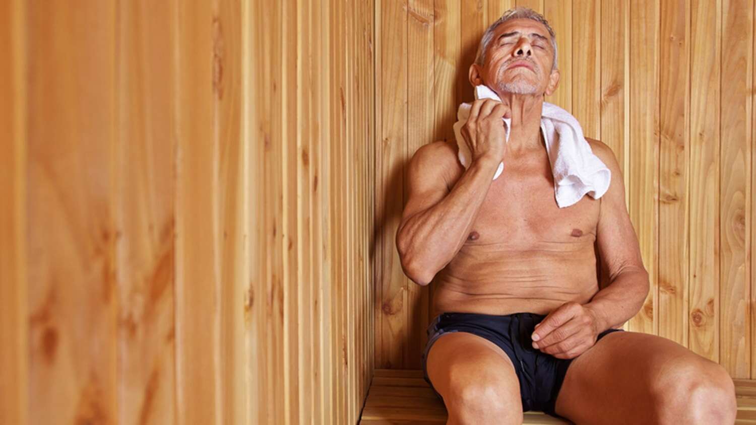 Wiping sweat in a sauna