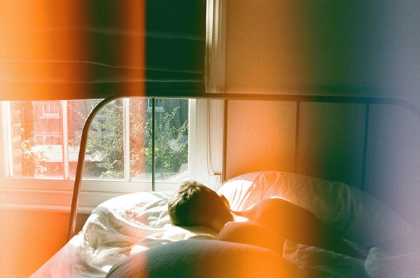 A Man Sleeping Opening Window