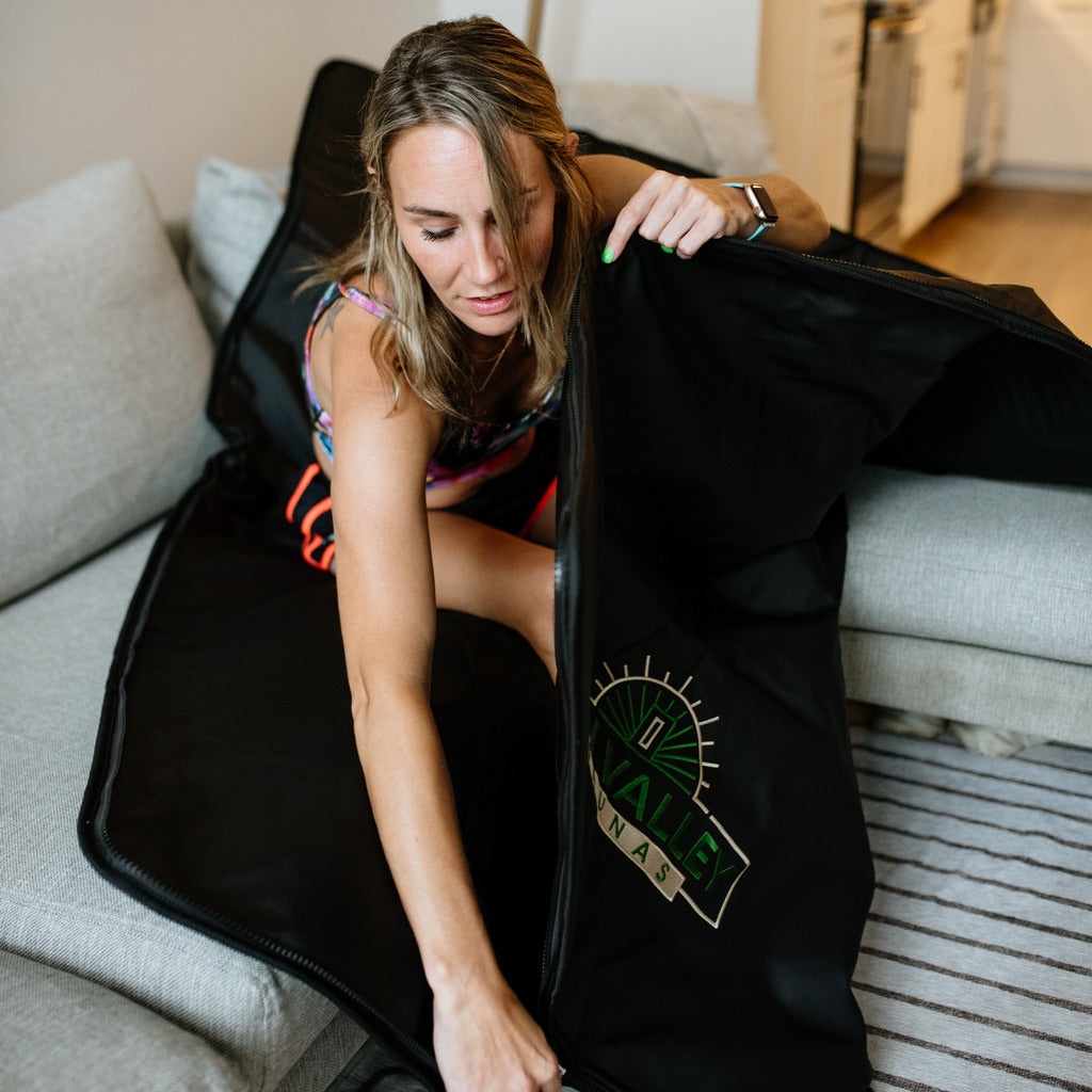 A woman in an infrared sauna blanket