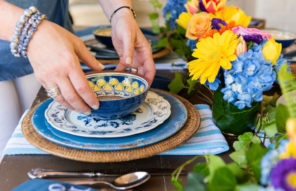 Blue and White Kitchen Towels on a Table as placemats