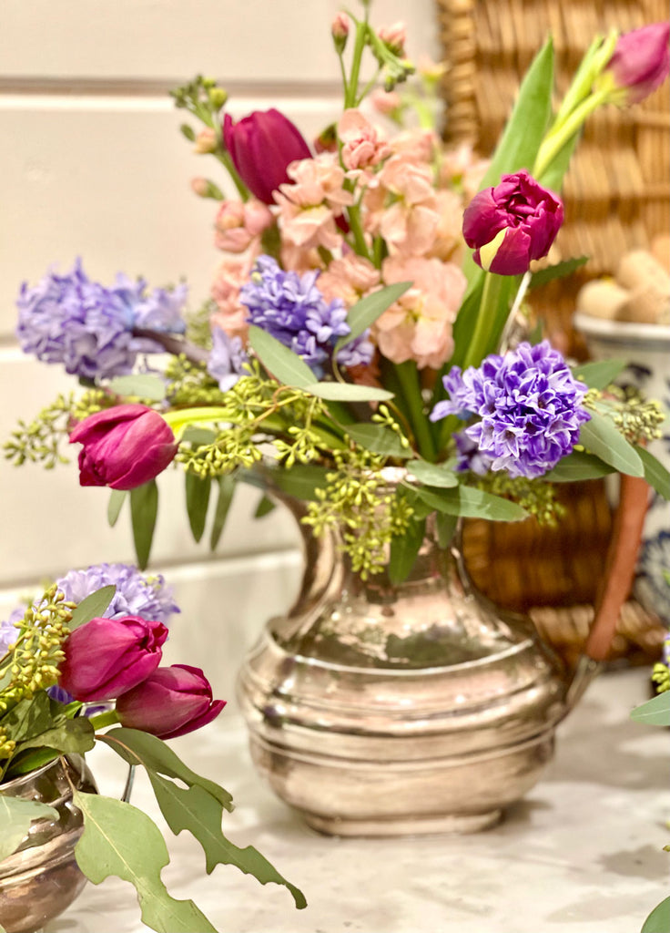 Flowers in a vintage silver tea set