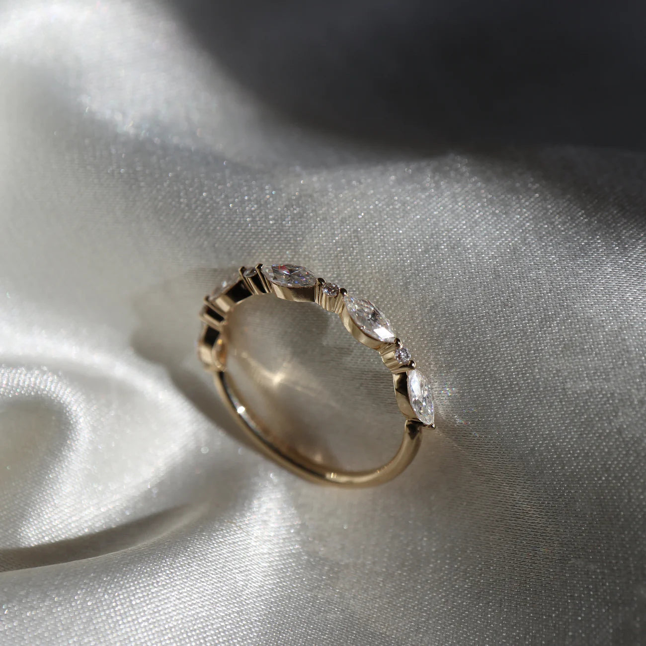 The Freya Ring - Marquise and Round Brilliant Band  Stylish and unique, The Freya Ring features a band carefully lined with marquise & round brilliant cut cultured gemstones that gracefully curve around the finger. A mesmerising, timeless piece.