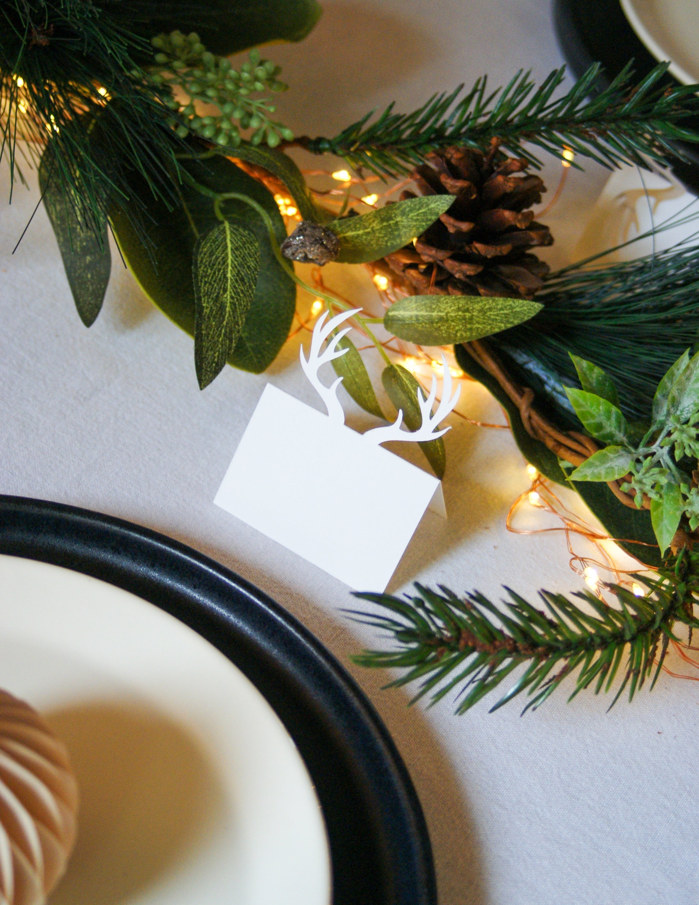 What a Host Home Decor: Christmas Tablescape with Porcelain Black Plates, Black Stainless Steel Cutlery Sets, Rustic Cotton Gauze Table Textiles, Taper Candles and Iron Black Candle Holders