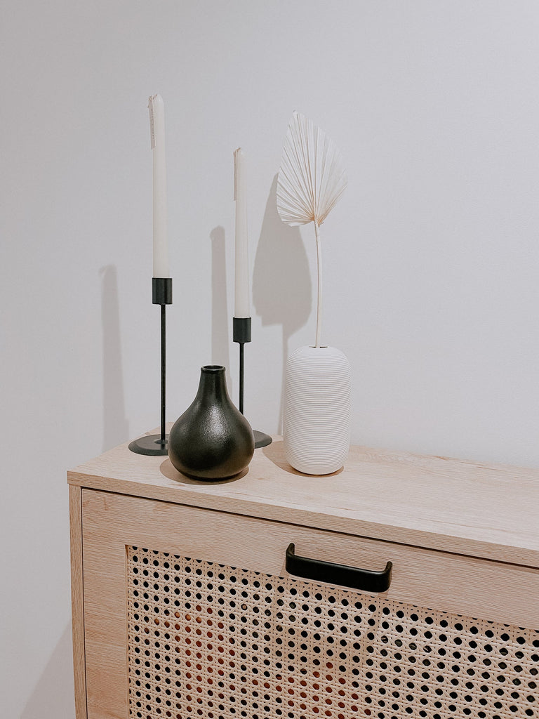 Derby Hallway Decor What a Host: Modern White ceramic vase, minimal black ceramic vase, black candle holders, tapered vanillas dinner candles, natural dried flower palm leaf. Home decoration.