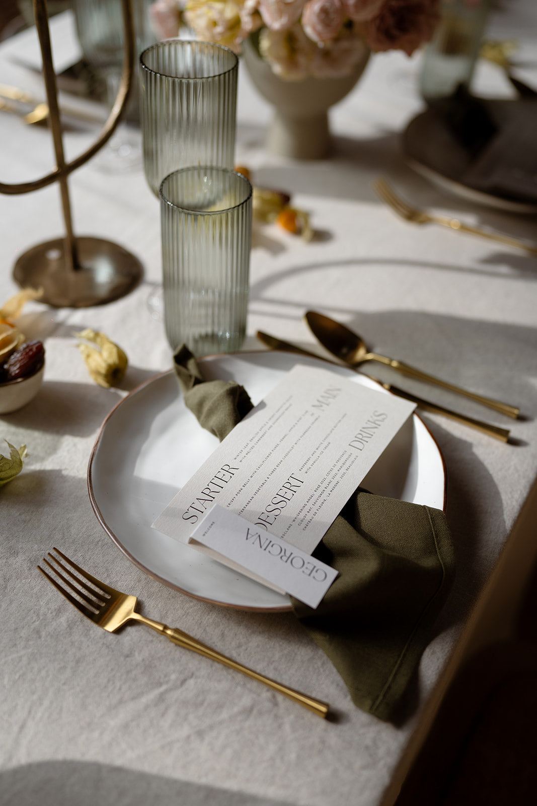 What a Host Home: Wedding Tablescape with gold cutlery, linen table napkins, porcelain round plates, gold candle holders