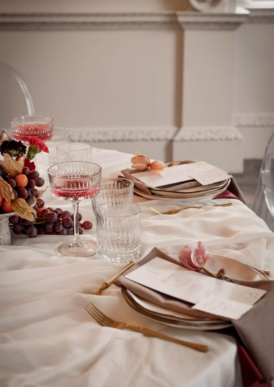 What a Host Home: Modern Wedding tablescape with gold cutlery, gold iron rustic candle holders, porcelain plates, and linen napkins